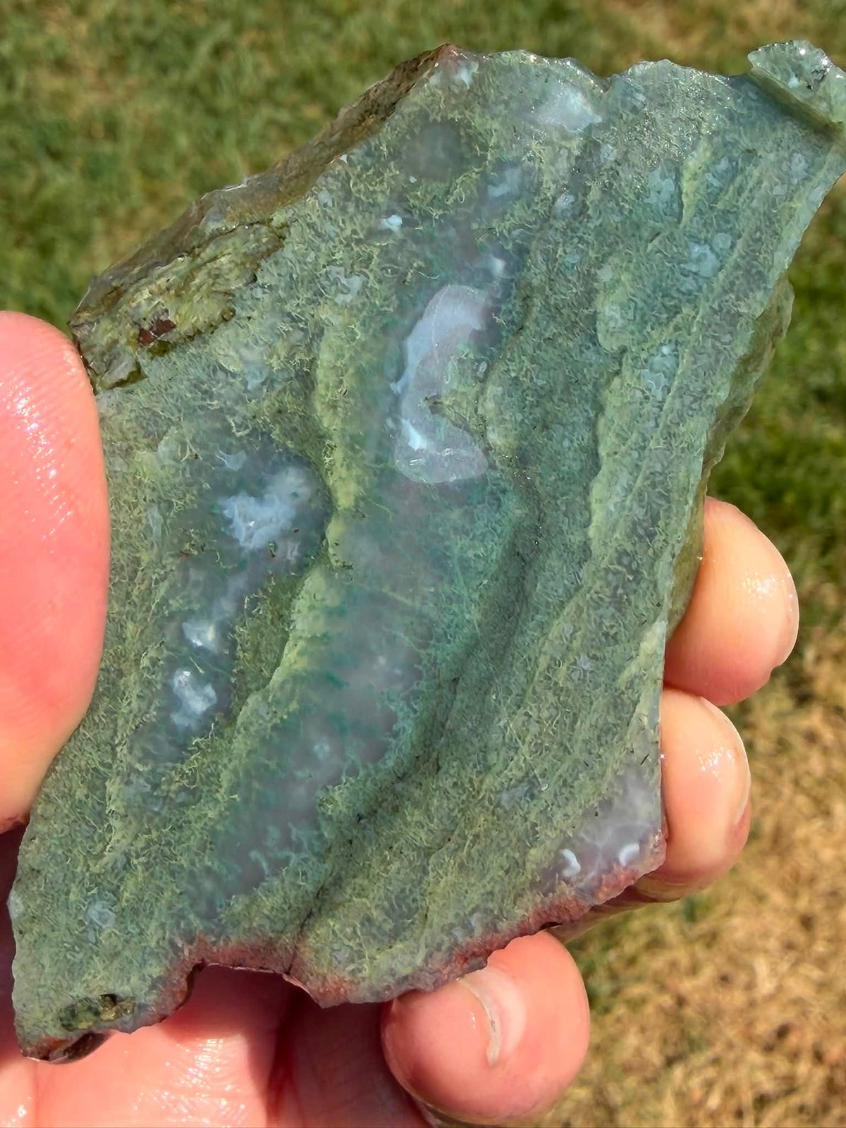 Supplier photograph showing the character and inclusions of a green moss agate slab