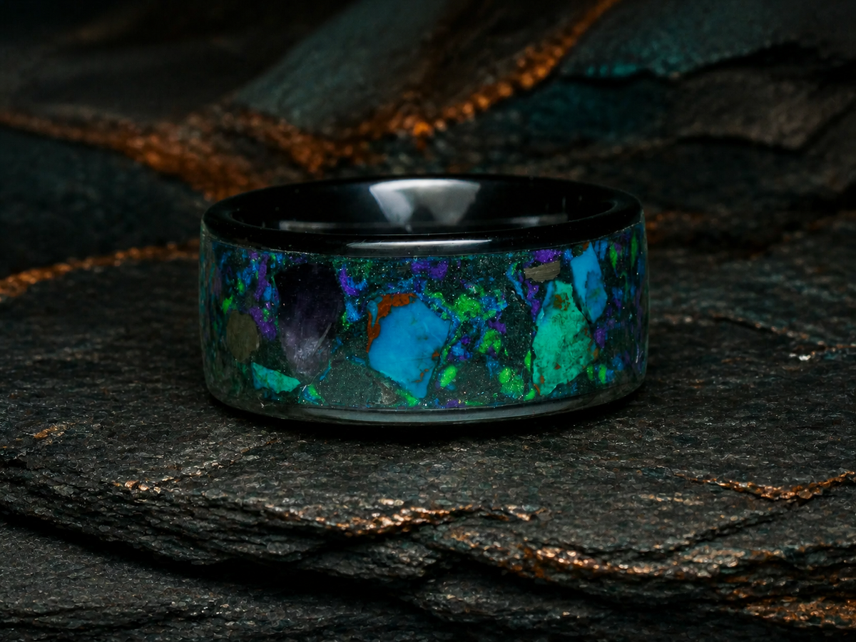 Oceanfire Mosaic angled black ceramic ring detail on dark geological slate with teal mineral accents