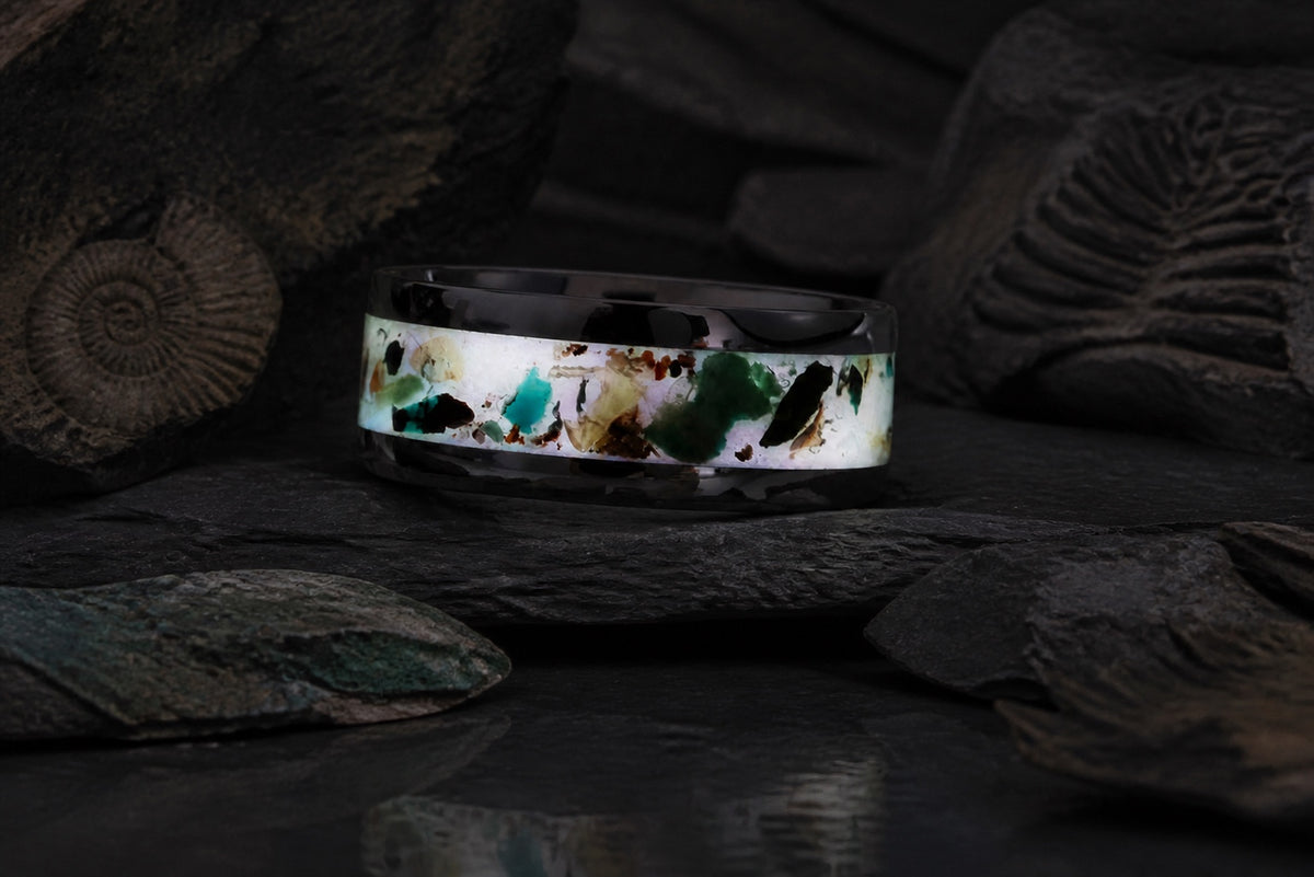 The Remnant Archive Ring glowing on a dark mineral stone bed