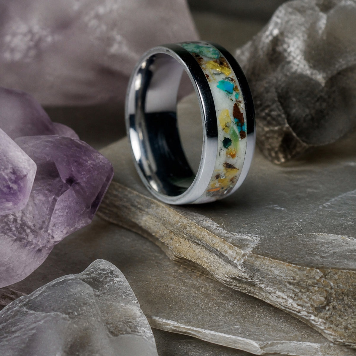 The Remnant Archive Ring resting on pale amethyst crystals
