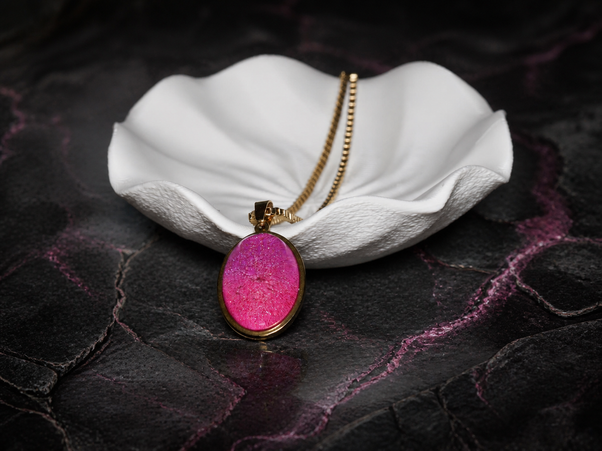 Rose Strata pendant displayed beside a sculptural white dish