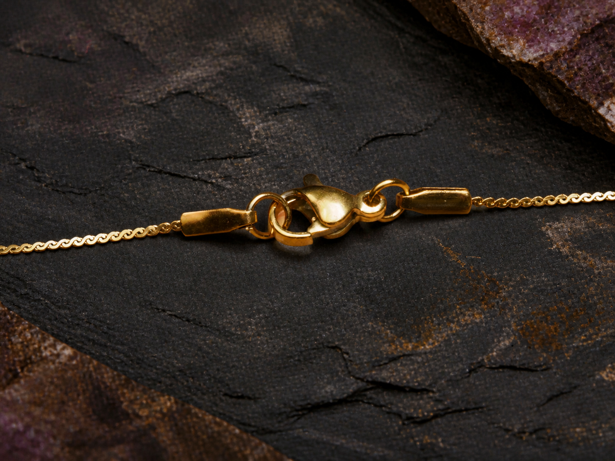 Fine gold chain clasp for the Rose Tide Orbit round pendant on dark mineral stone
