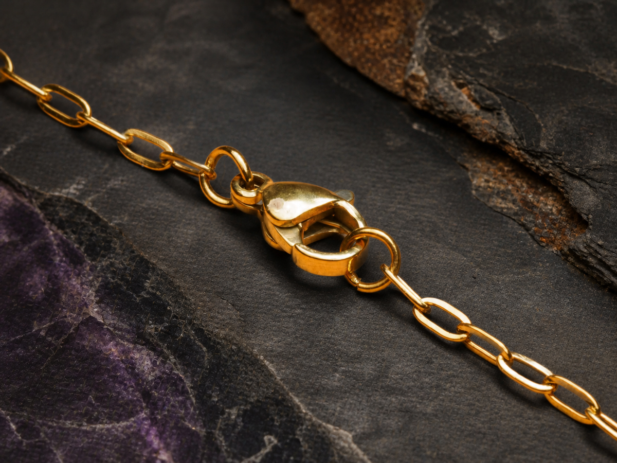 Gold chain clasp and fine links for the Rose Tide Orbit pendant on dark mineral stone