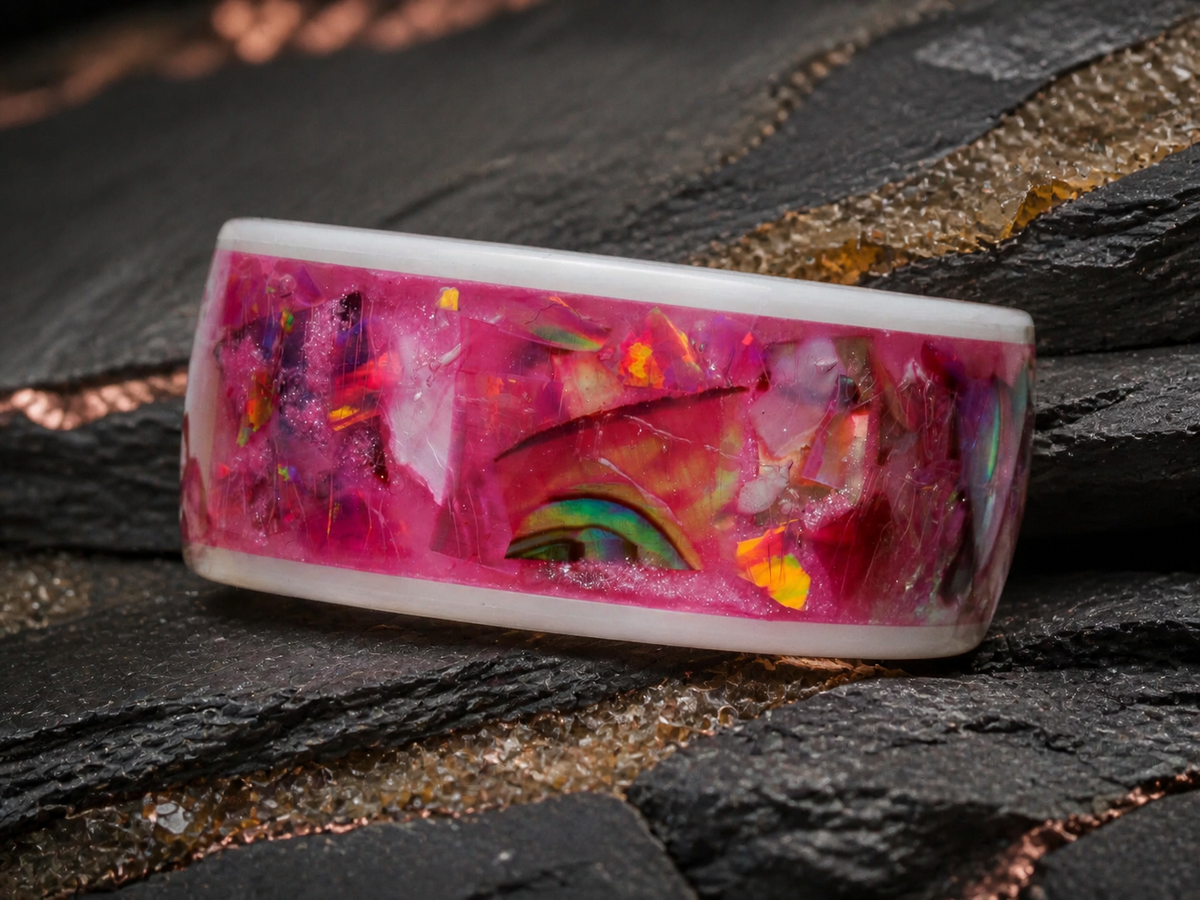 Rosetide Lumina pink shell and opal inlay ring on dark geological slate