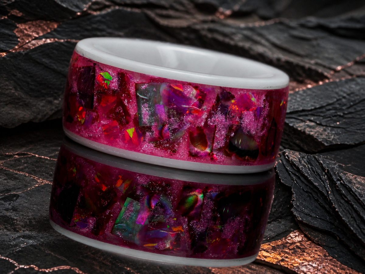 Front detail of the Rosetide Lumina white ceramic ring with pink inlay