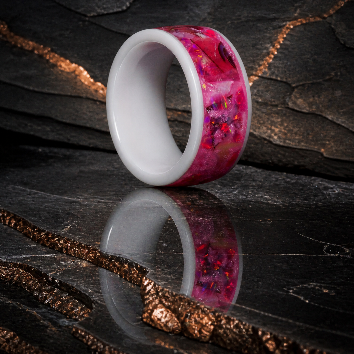 Rosetide Lumina white ceramic ring shown upright on dark stratified slate
