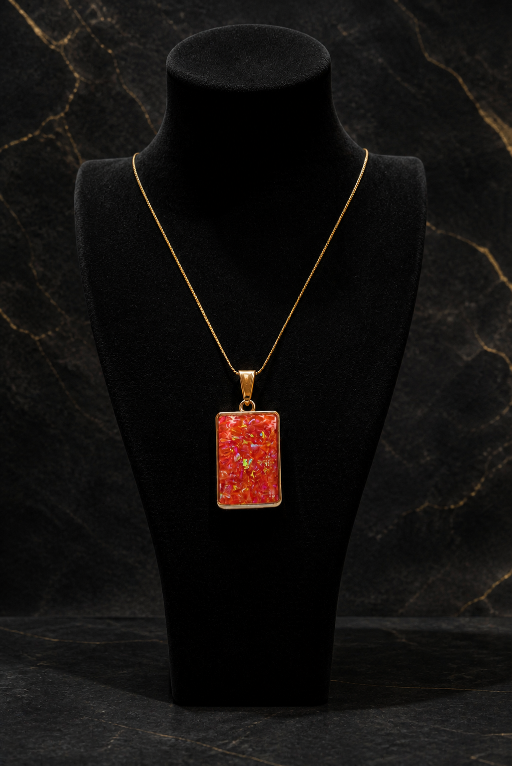 Solar Ember Prism pendant worn on a fine gold chain