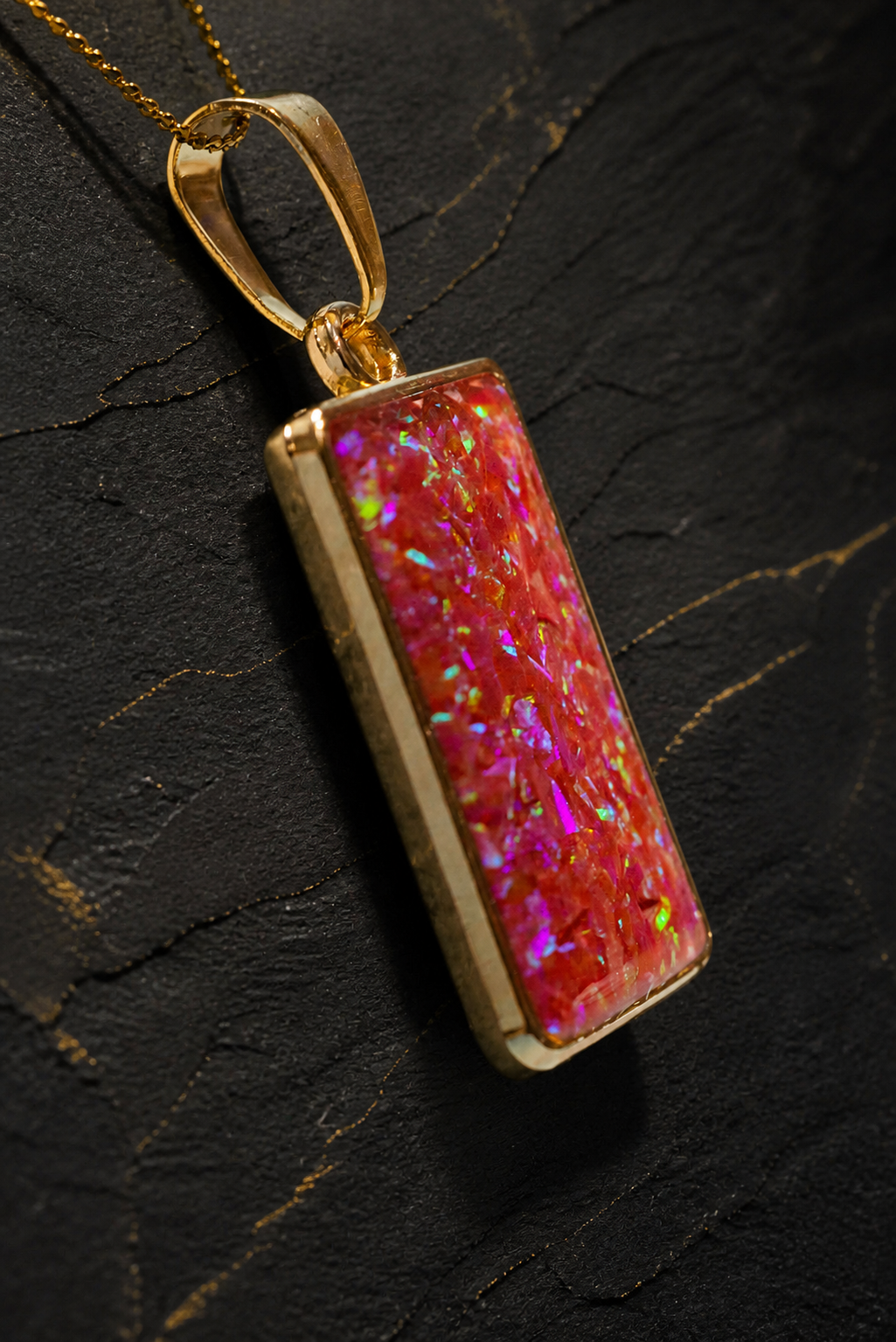 Solar Ember Prism pendant angled detail showing gold bezel