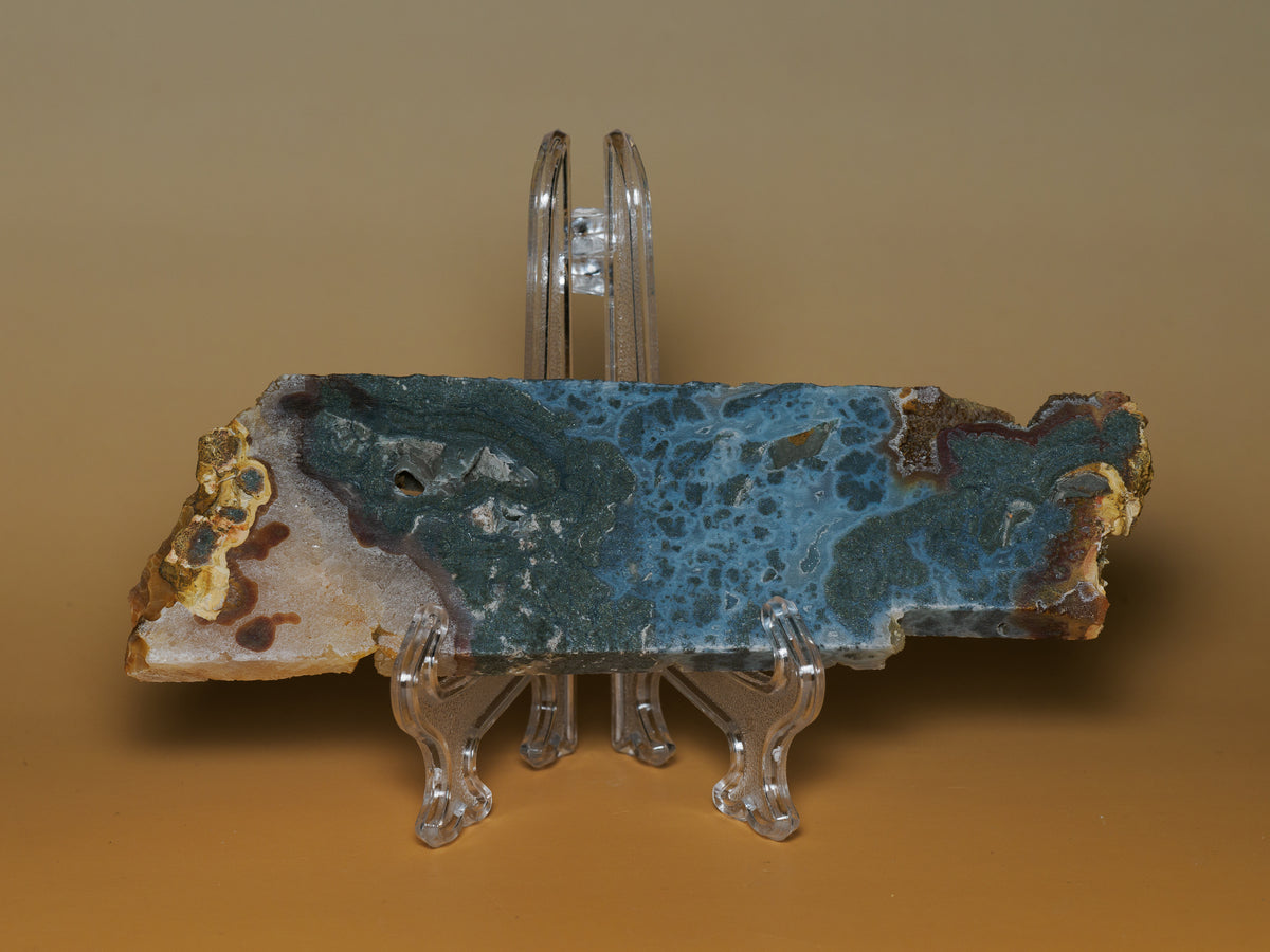 Marcasite-labelled slab from Sulawesi, Indonesia, showing a blue-grey patterned face and natural cream and rust-coloured edges