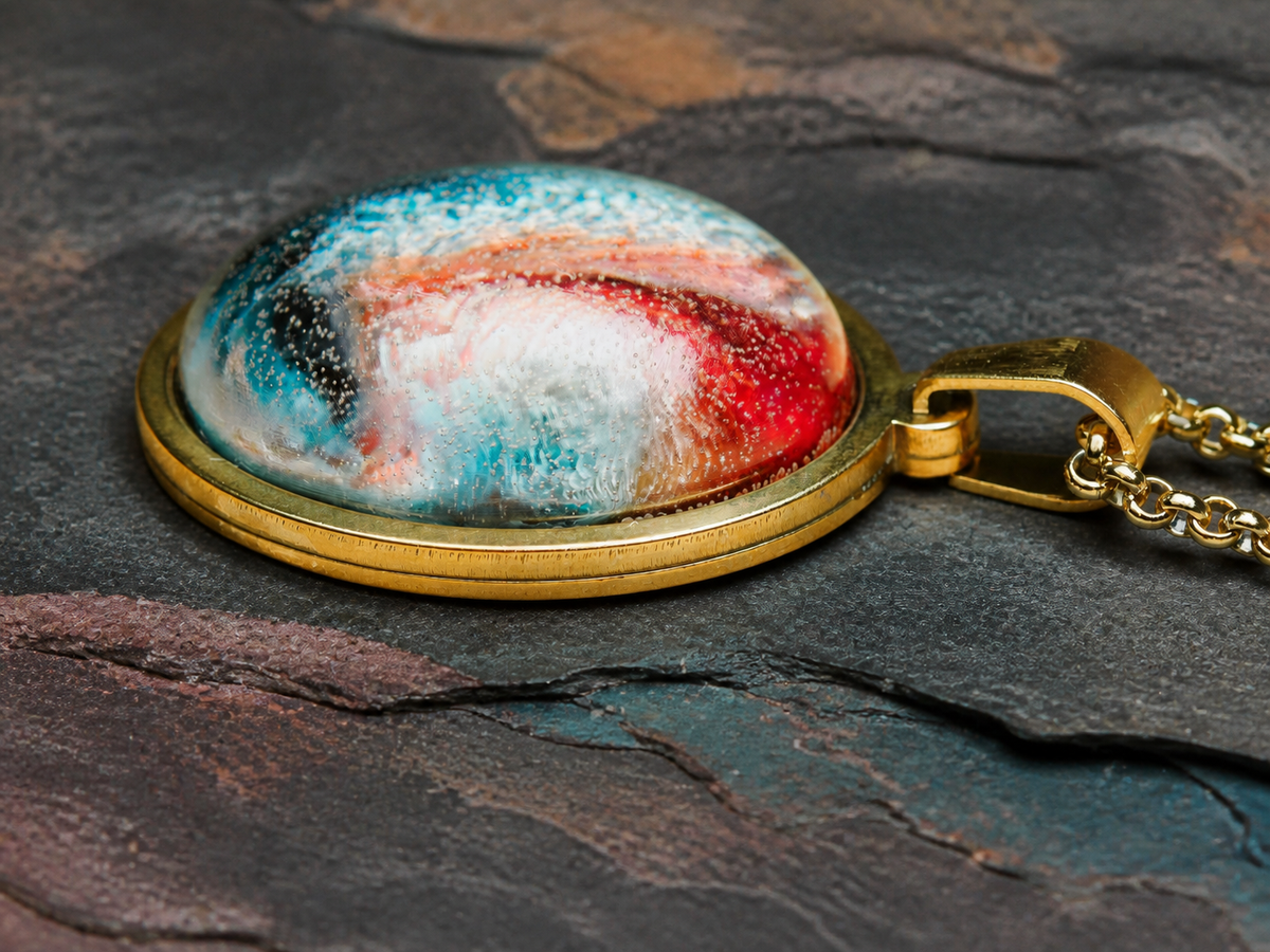 Low-profile close-up of the red and turquoise Thermal Rift resin pendant