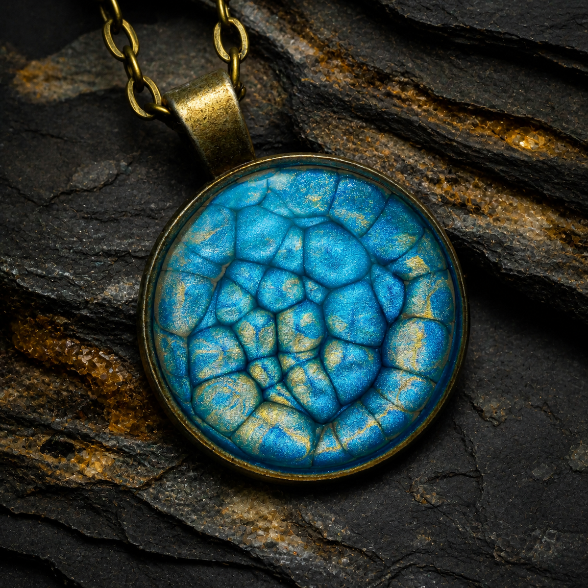 Thevenard Vein blue and antique-gold round pendant on dark stratified stone