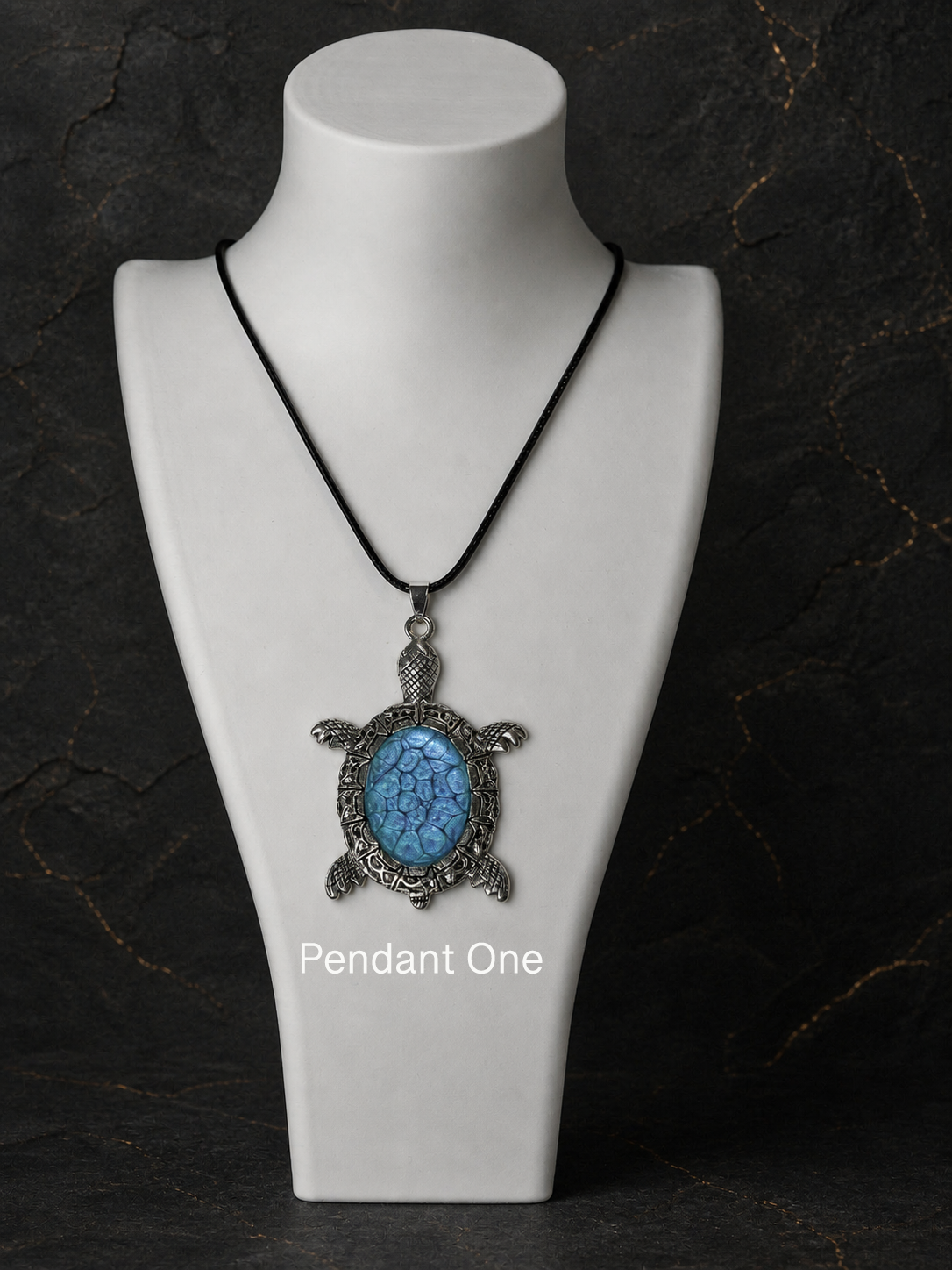 Pendant One silver turtle pendant worn on a black cord necklace