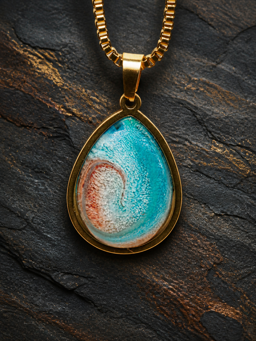 Close-up of Tidal Rift turquoise alcohol-ink and resin teardrop pendant