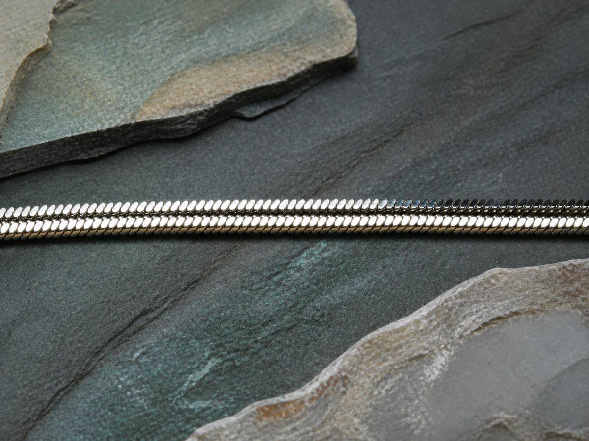 45cm silver plated chain on slate, agate, and earthy mineral textures