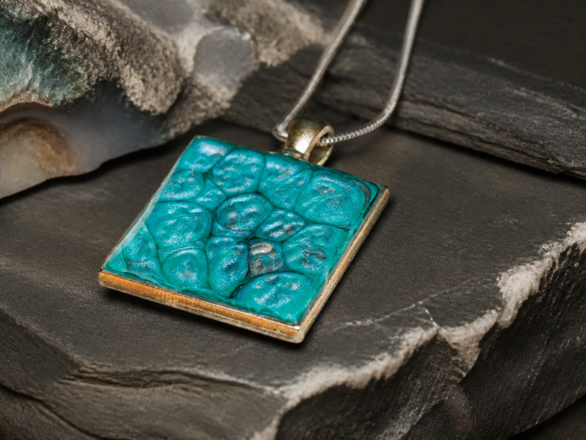Silver square pendant with teal enamel and resin finish on layered rock