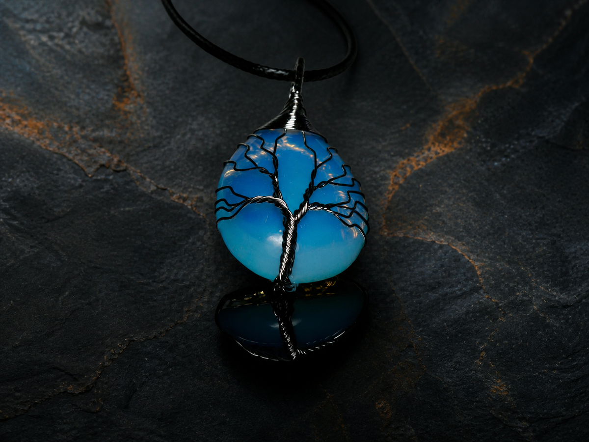 Blue Ember silver wire-wrapped Tree of Life pendant with blue and golden-yellow stone