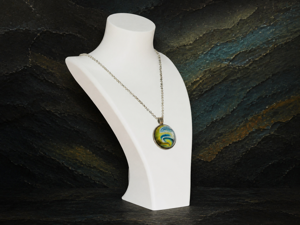 Angled view of the Verdant Gyre silver pendant necklace on a white display bust