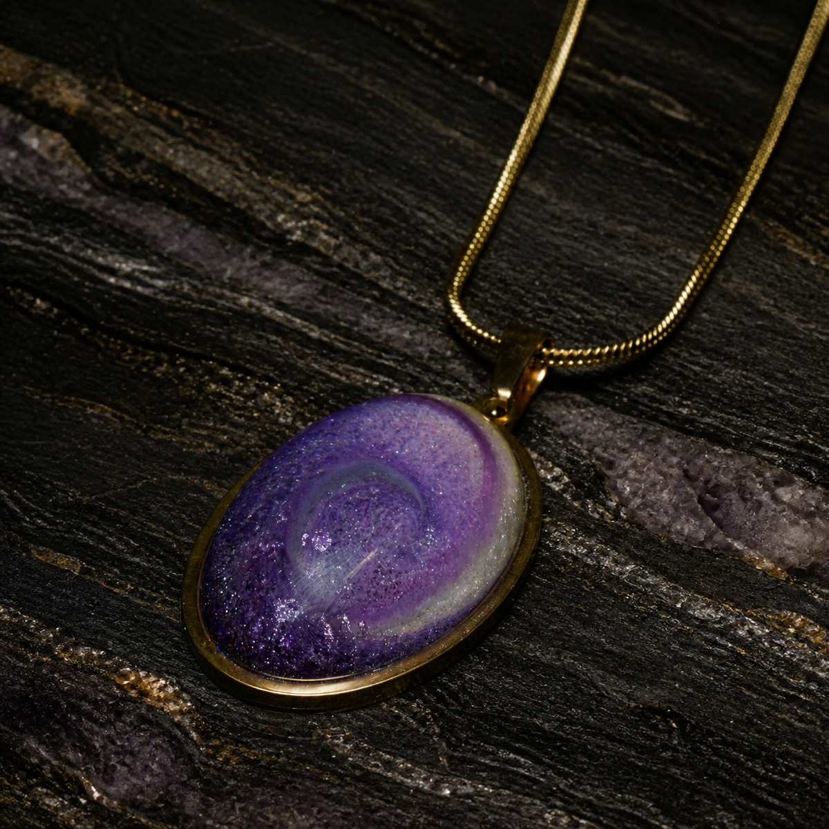 Violet Gyre purple oval pendant with gold snake chain, square product view