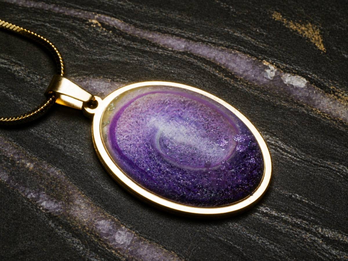 Violet Gyre resin dome and 18k gold-plated oval bezel, close detail
